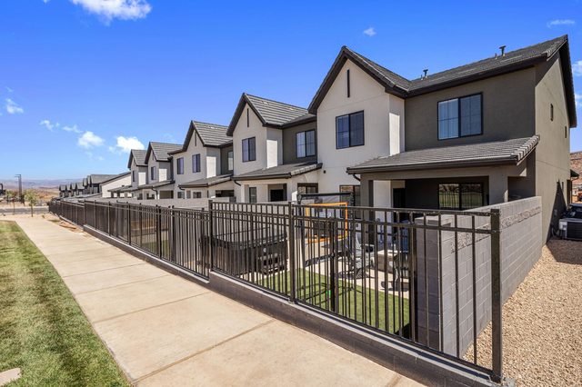 Rear exterior of Skyline 1694 townhomes with fenced yards