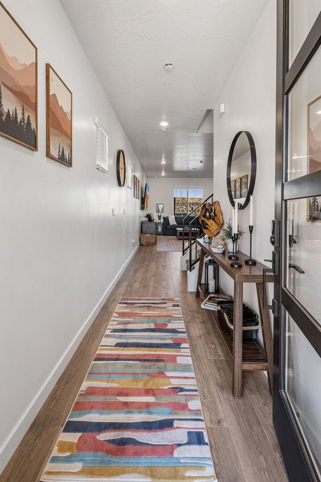 Entry hallway with colorful runner and wood console table