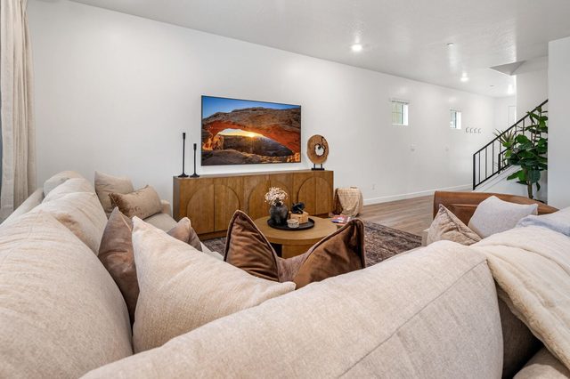 Plush sectional facing the TV and wood media console