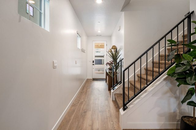Downstairs hallway and staircase leading to the upper level