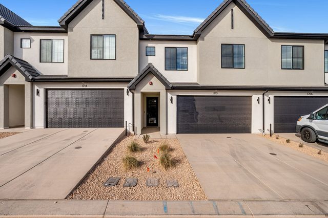Front of Skyline 1710 townhome with garage and driveway