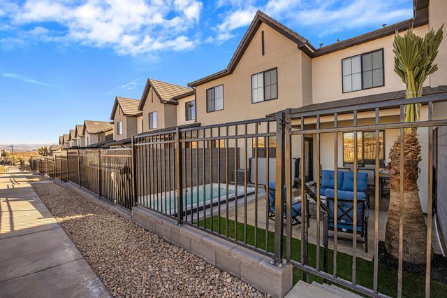 Fenced backyard and rear exterior of the Skyline Resort townhomes