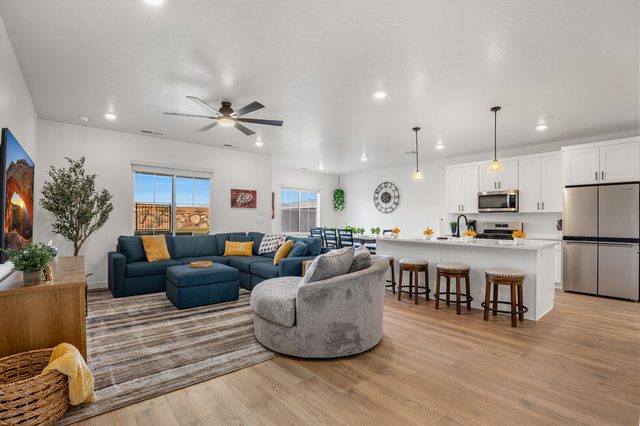 Open living room flowing into the kitchen and dining area