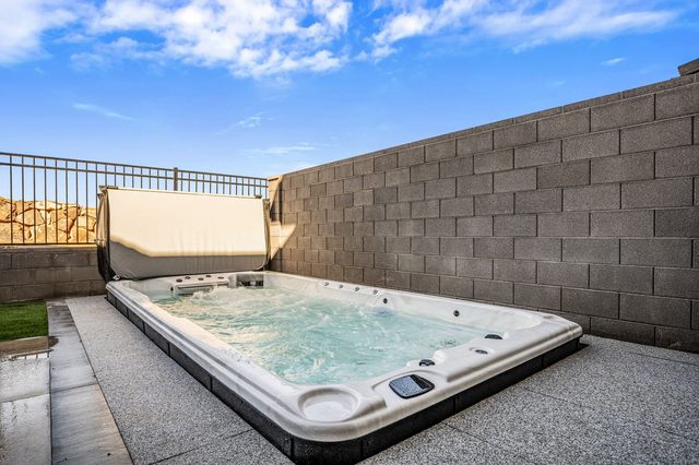 Private swim spa with jets in the walled backyard