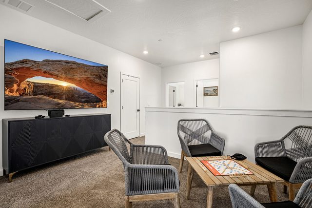 Upstairs loft with smart TV and game table seating for four
