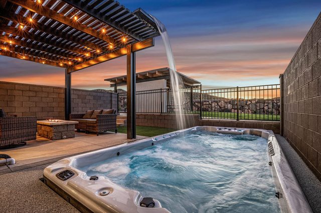 Swim spa with pergola waterfall at sunset at Skyline 1714