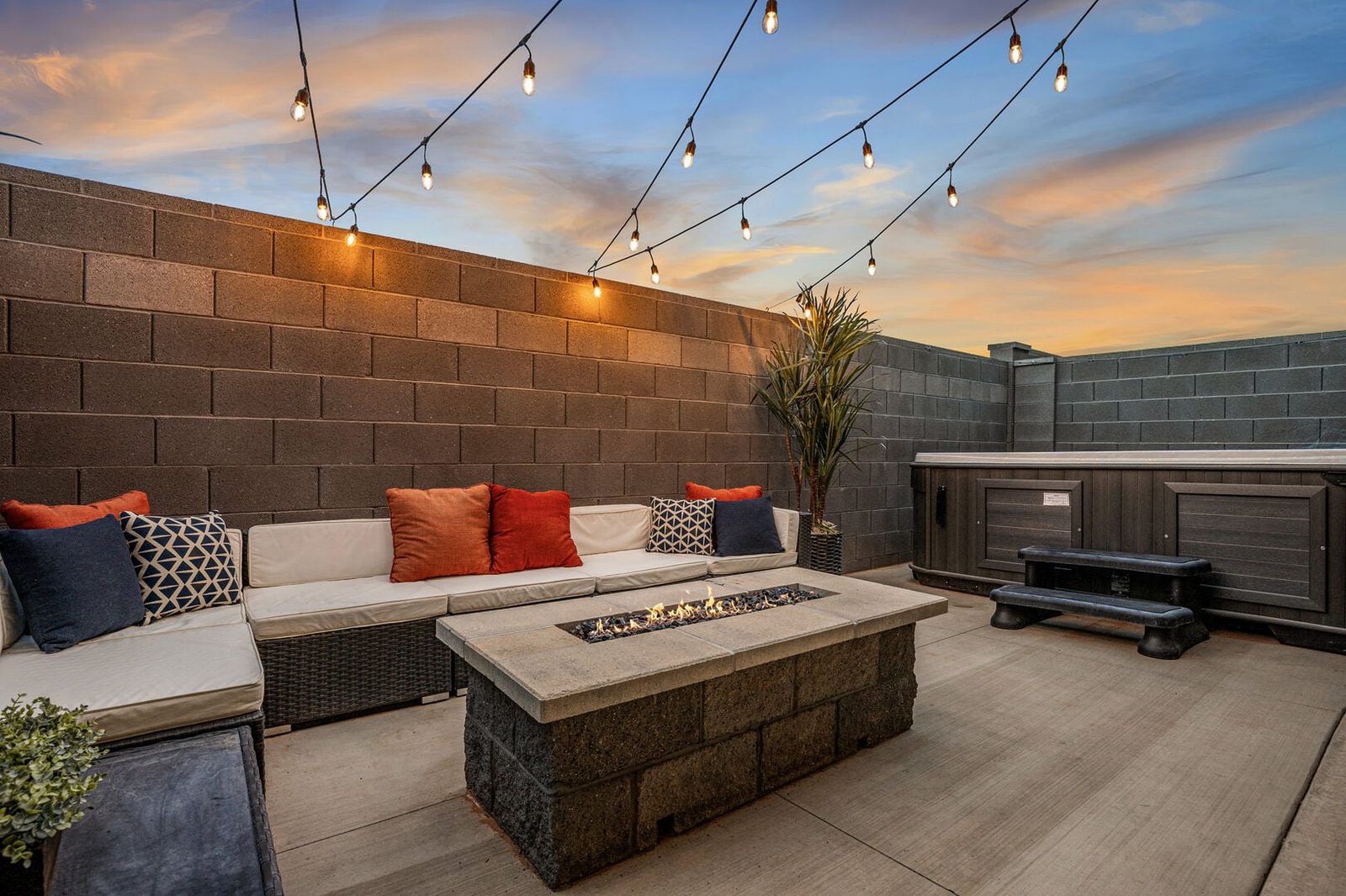 Private courtyard with fire pit, sectional and hot tub at Skyline 1729