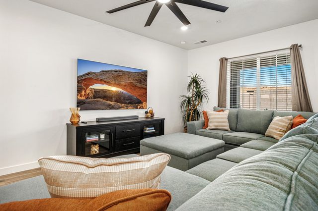 Sectional sofa and media console in the living room at Skyline 1729