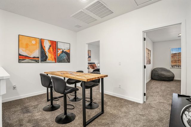 Upstairs loft with high-top table and bar stools at Skyline 1729
