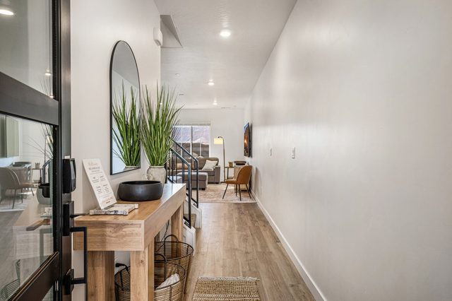 Entry hallway with console table leading to the main living area