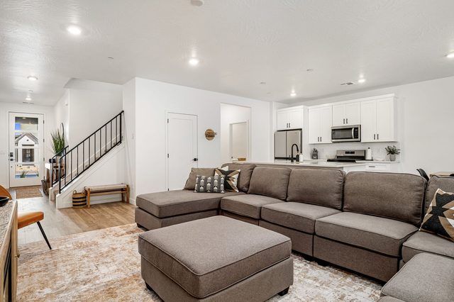Great room seating with view toward the entry and kitchen