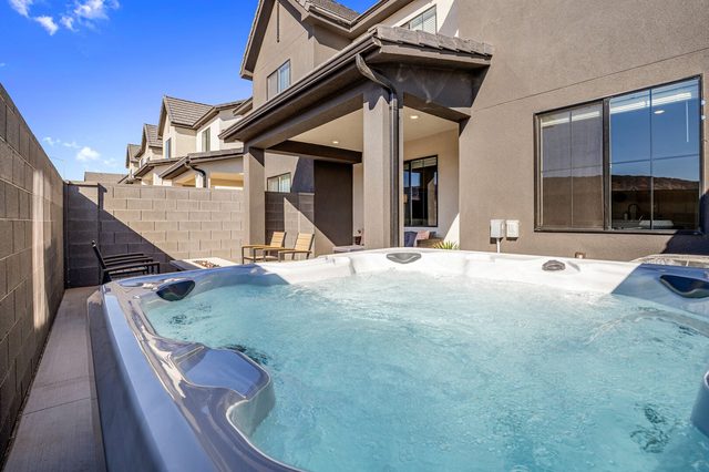 Private hot tub beside the covered patio at Skyline 1737