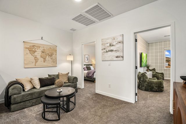 Upstairs loft lounge with sleeper sofa and world map art
