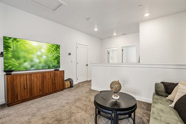 Loft lounge with smart TV and round coffee table