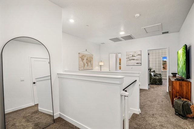 Upstairs landing and loft with arched mirror