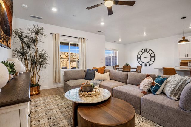 Sectional seating with kitchen and dining area beyond