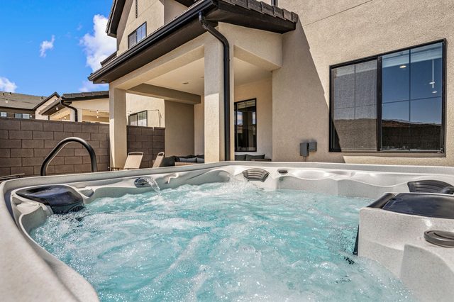 Private hot tub with the covered patio behind it
