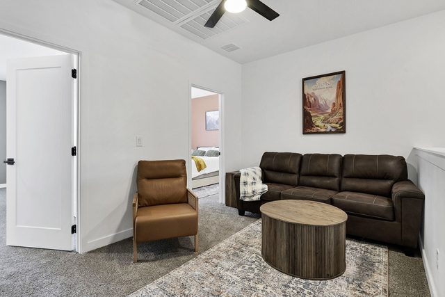 Upstairs loft lounge with leather sofa and round coffee table