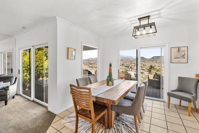 Dining table beside sliding doors to the covered deck