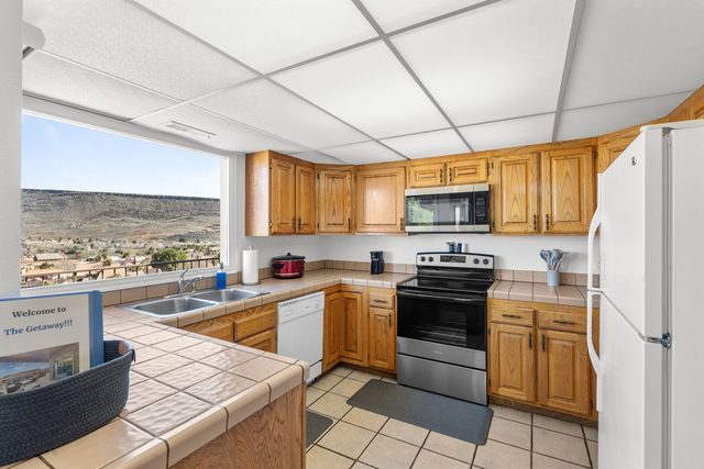 Kitchen with valley view window and stainless range