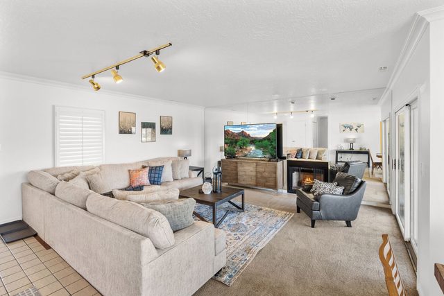 Living room sectional facing the TV and fireplace