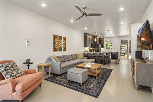 Open living room looking toward the kitchen and dining area