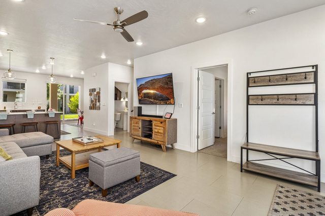 Living area with sectional, ottoman and entry hall tree