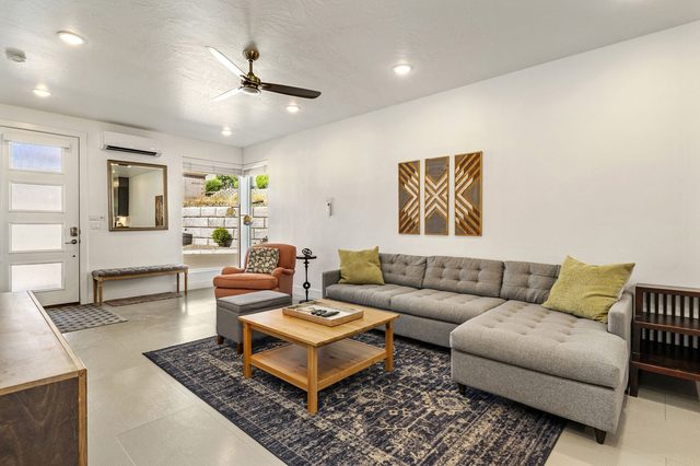 Gray sectional sofa and coffee table near the front entry