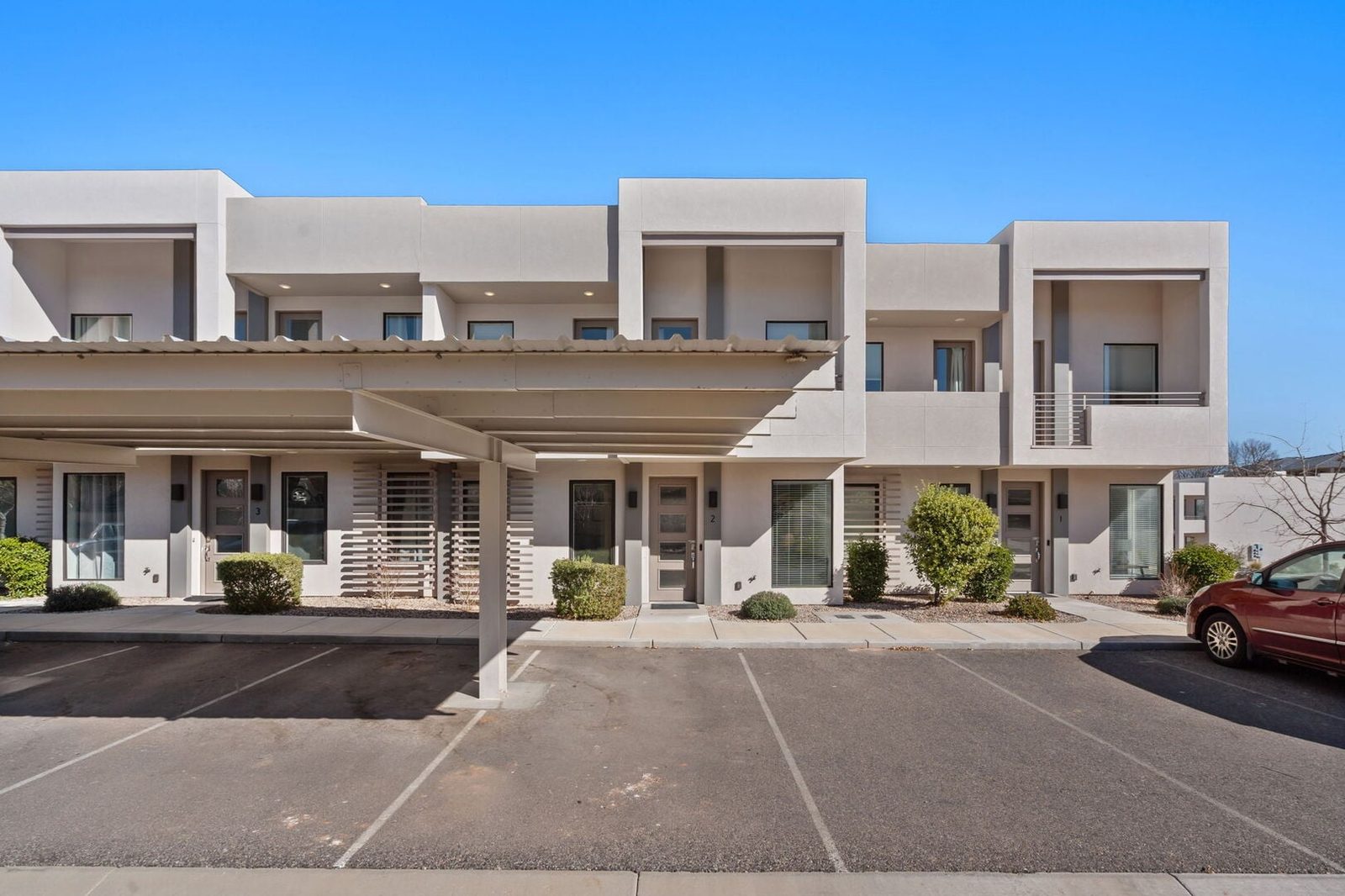 Two-story townhome row with covered parking at The Lofts 2