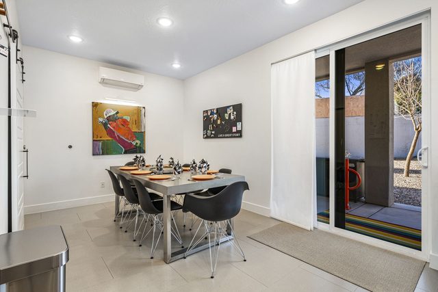 Dining table for six beside the patio sliding door