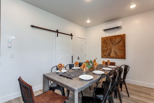 Dining table for eight with barn door at The Lofts 37