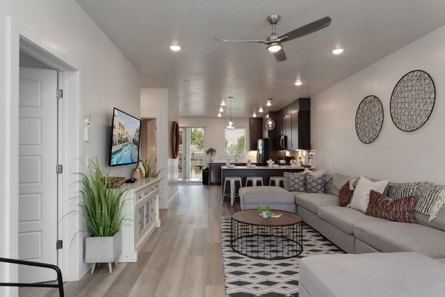 Open living room flowing into the kitchen at The Lofts 37