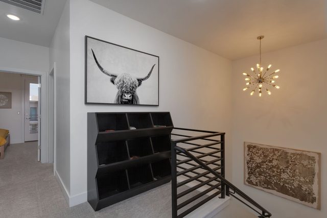 Upstairs landing with cubby shelf and stair railing