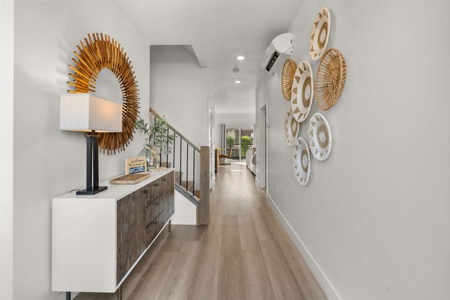 Entry hallway with console table leading to the stairs