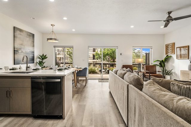 Open living area with sectional and kitchen island