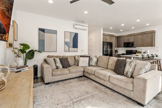 L-shaped sectional sofa with kitchen in the background