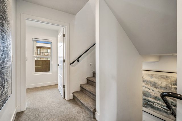 Second-floor hallway and staircase to the third floor