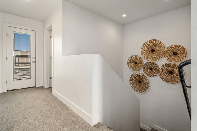 Third-floor landing with door to the upper deck