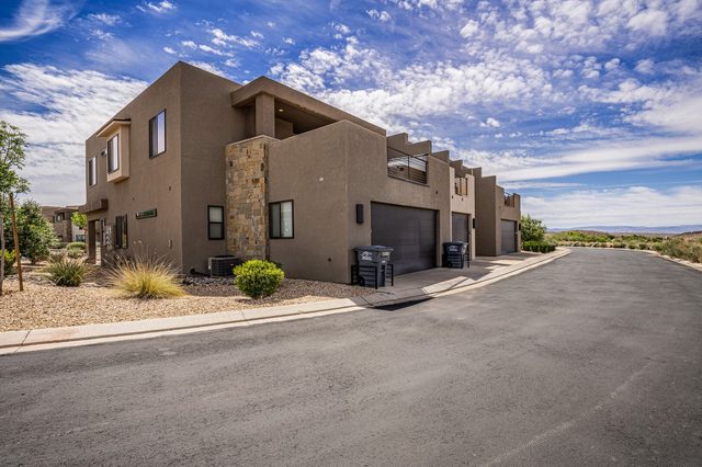 Street view of the townhome row and garages