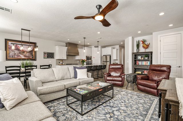 Open living room looking toward the kitchen and dining area