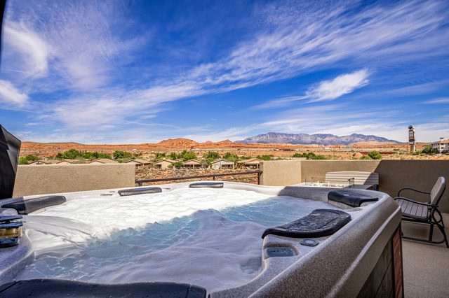 Private hot tub with red rock and mountain views