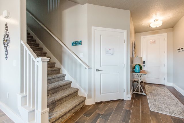 Entry with staircase, front door and console table