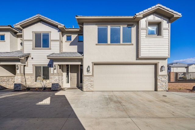 Front of the two-story townhome with two-car garage