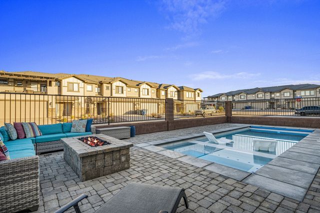Private pool with fire pit and sectional seating area