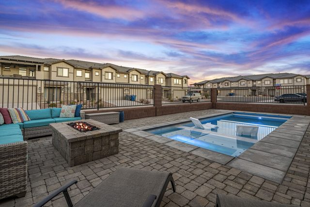 Private pool beside fire pit and wicker sectional