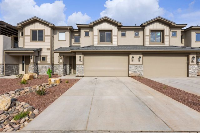 Front of Zion Village 268 townhome with two-car garage and driveway