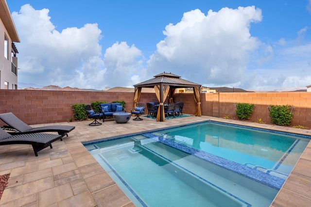 Private pool with gazebo and lounge chairs at Zion Village 268
