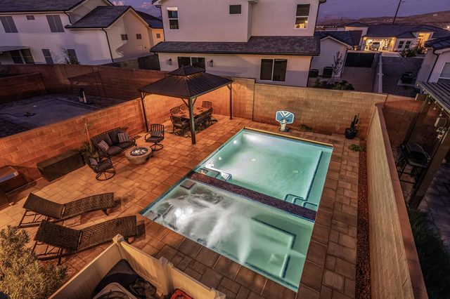 Overhead night view of the private pool and hot tub