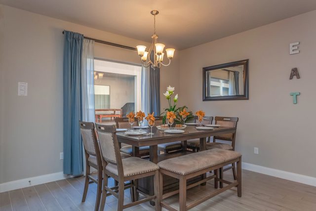 Dining table with bench seating and chandelier
