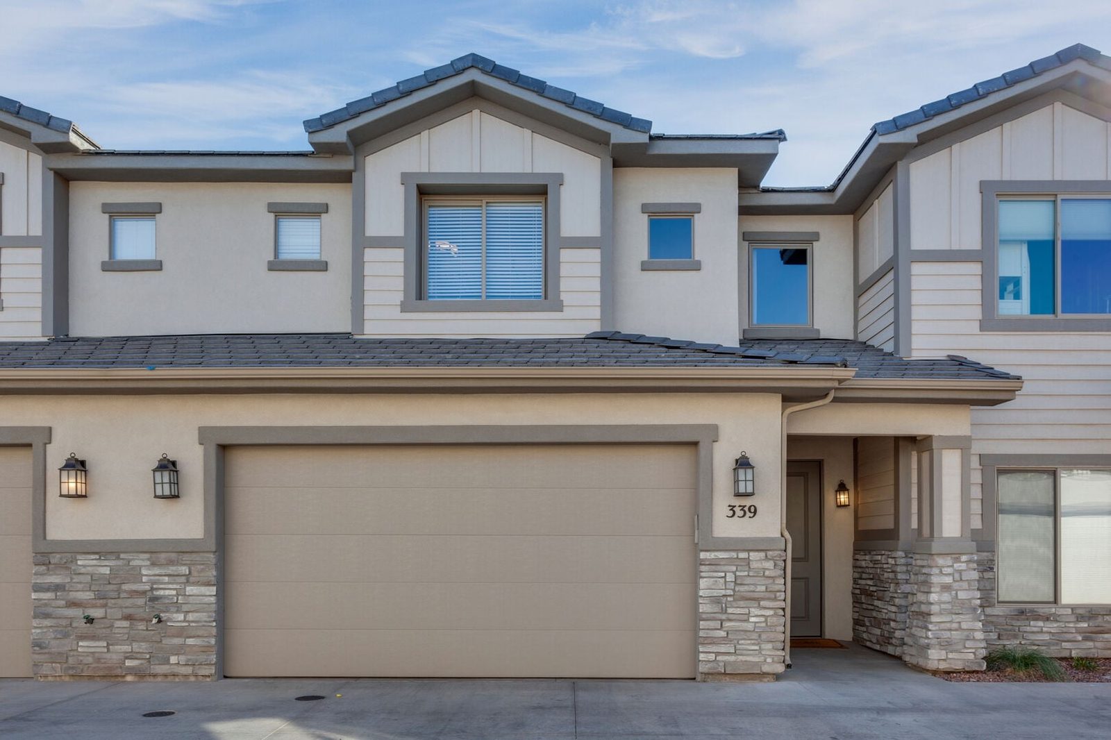 Front exterior of Zion Village 339 with two-car garage